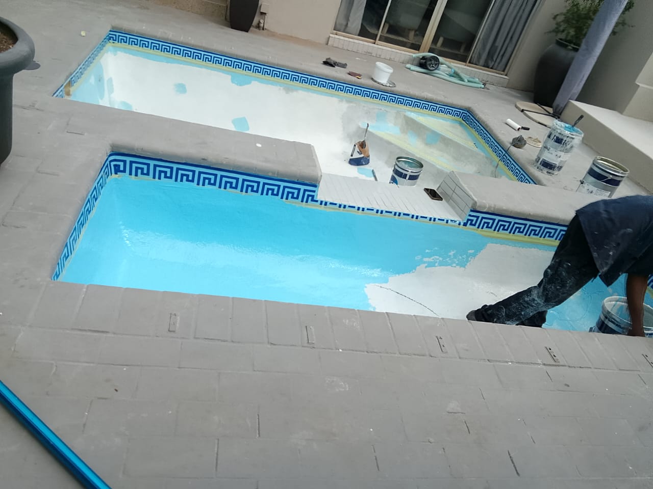 two part swimming pool being resurfaced