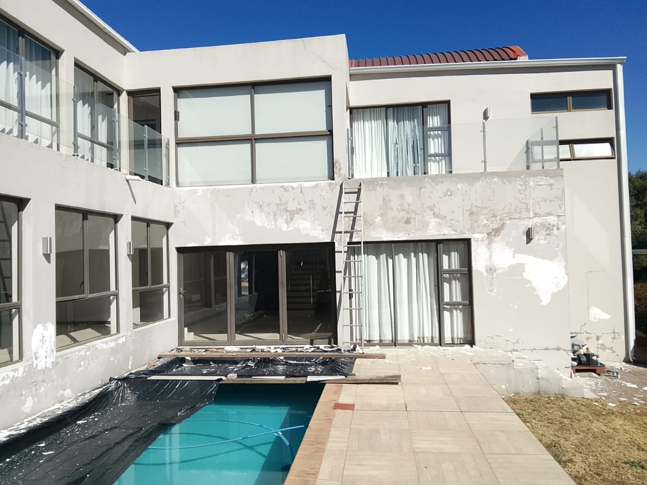 exterior of house being prepped for painting