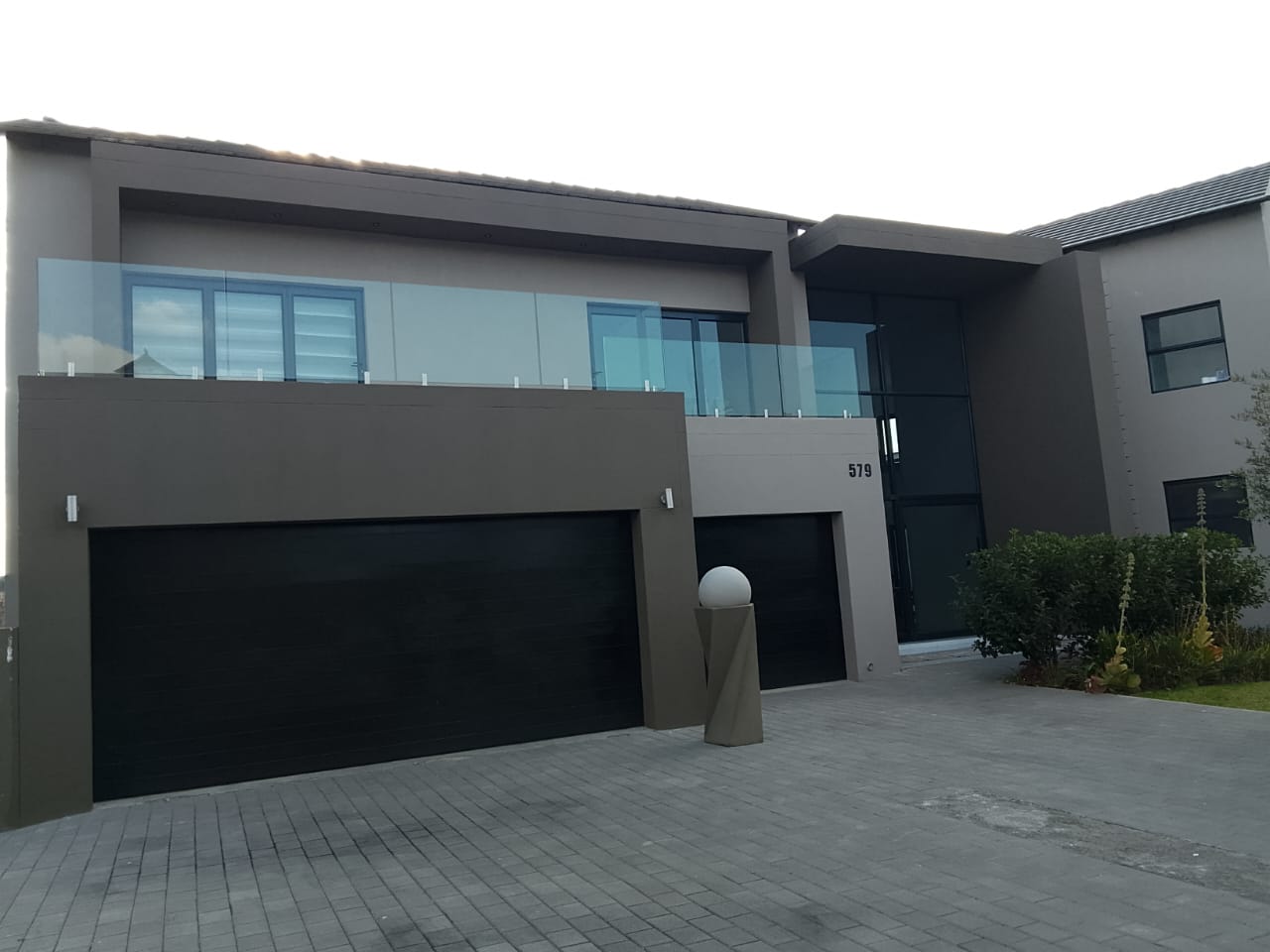 outside wall of house painted gray with darker gray trim