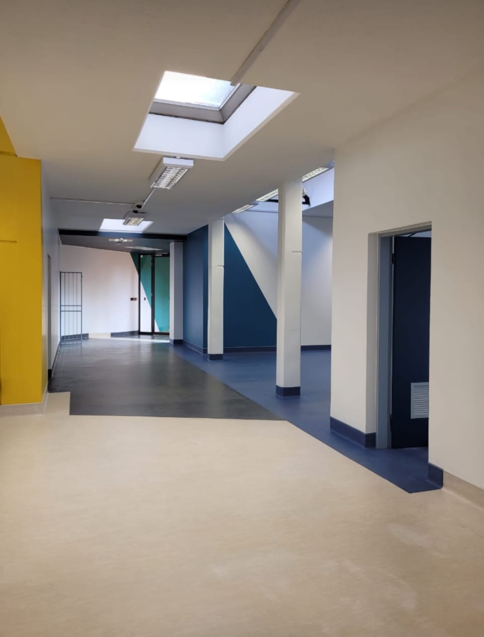 commercial hall way with white and blue walls