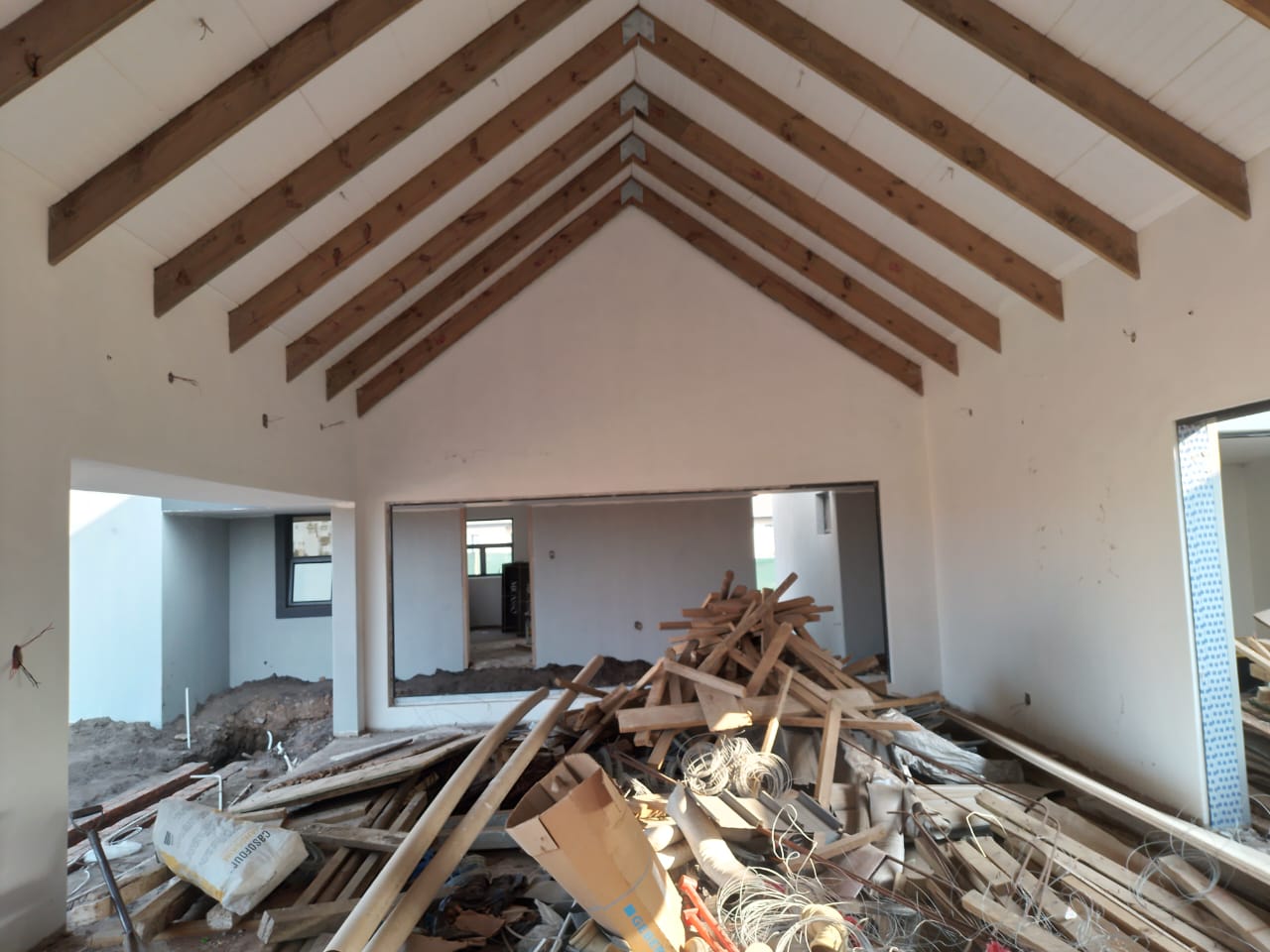 house interior being renovated with rubble on the floor